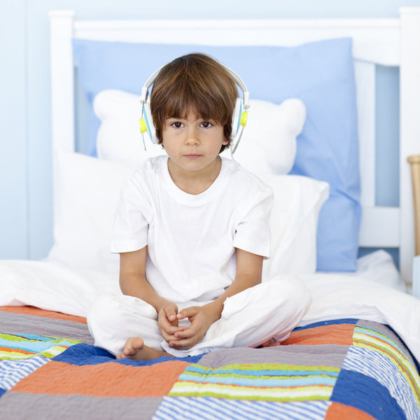 At what age should my child stop wetting the bed?