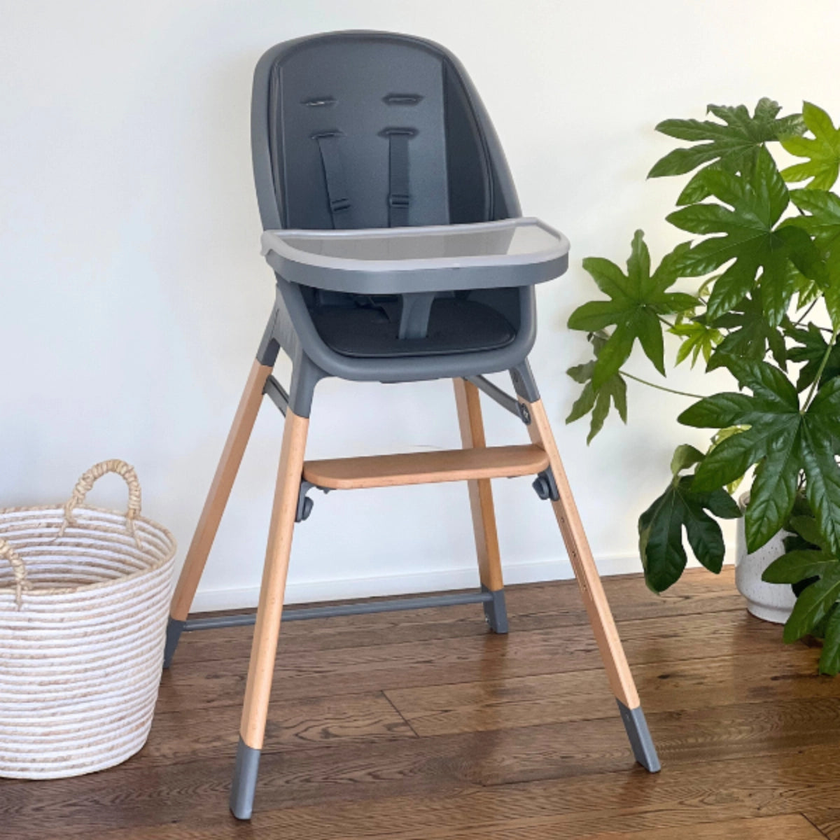 MOOSE Harper High Chair in charcoal grey with natural wooden legs, feeding tray and adjustable footrest.
