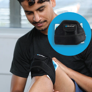 A man wearing a black VibraCool knee support sleeve while having his knee examined, with a blue circular inset showing the knee sleeve packaged.